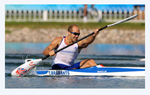 Sprint paddler with the airborne blade nearly flat to the wind