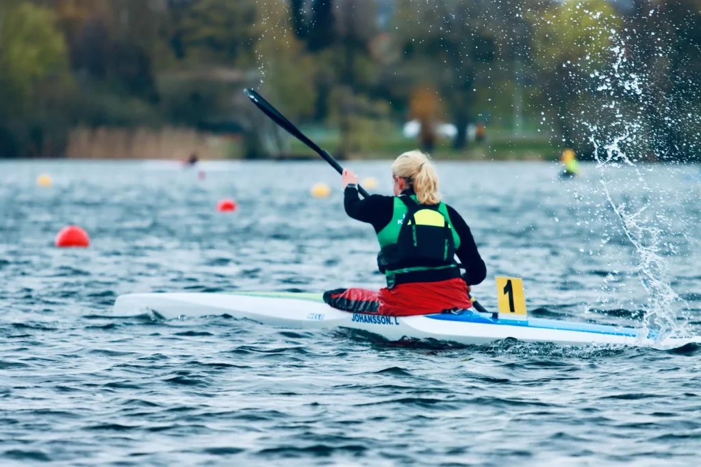 Sprint kayak catch with the blade buried and the hull already moving past the paddle